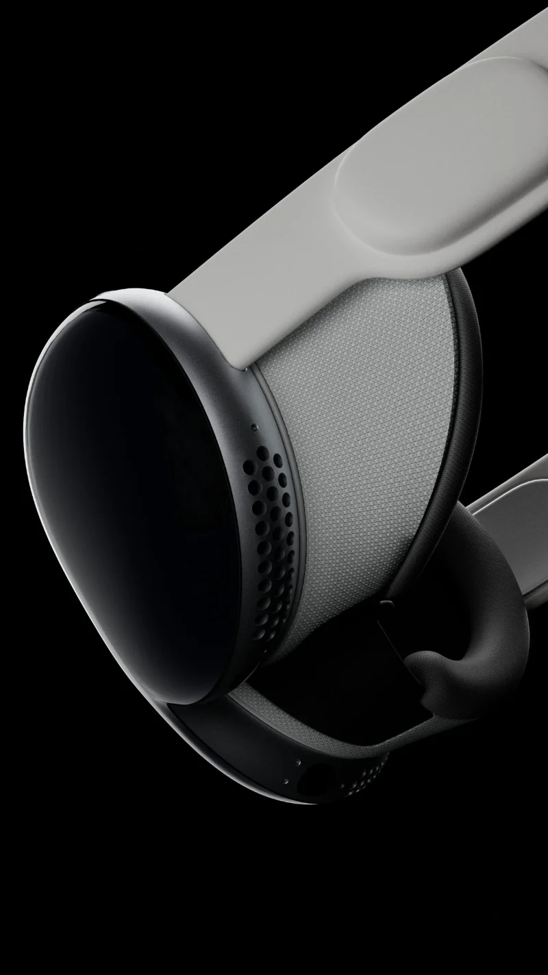 Apple Vision Pro CGI render - three-quarter view of the headset and knitted head strap in soft studio light on black
